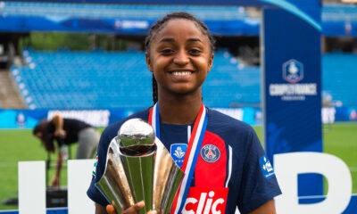 Laurina Fazer holds the Coupe de France Féminine trophy after Paris Saint-Germain won the competition in 2024.