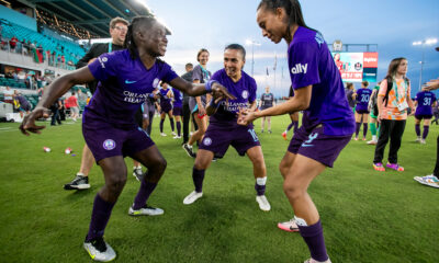Barbra Banda and Marta celebrate Orlando's victory against Kansas City.