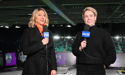 Jacqui Oatley and Lori Lindsey hold CBS Sports microphones at the 2024 NWSL final at CPKC stadium.