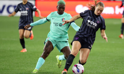 Two players battle for the ball