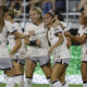 Gisele Thompson celebrates with her teammates after scoring for Angel City against the Washington Spirit.